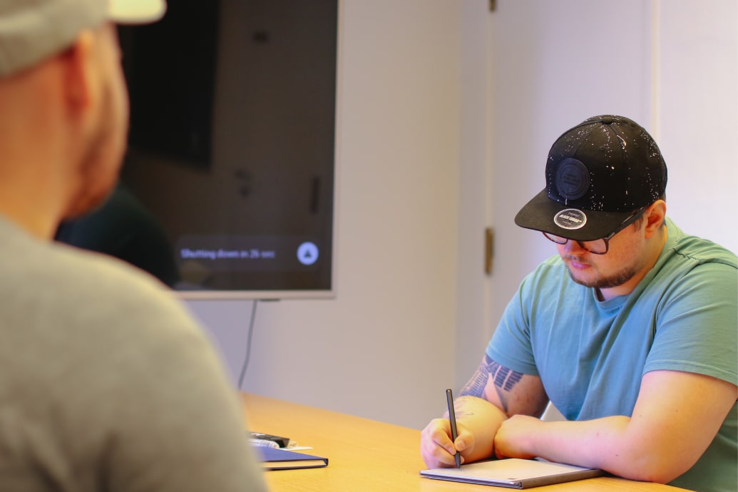 Maritime Optima employees sitting in a meeting..